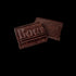 Bourbon Barrel Foods Benne Seed Chocolate Bar broken in half
